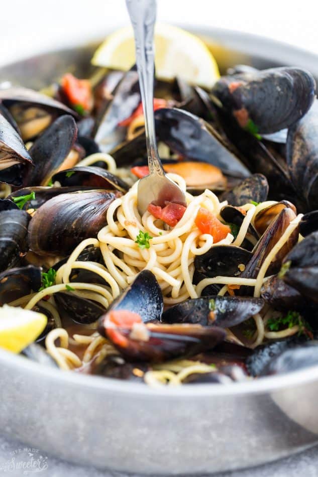 Close-up view of Steamed Mediterranean PEI Mussels with pasta in a bowl
