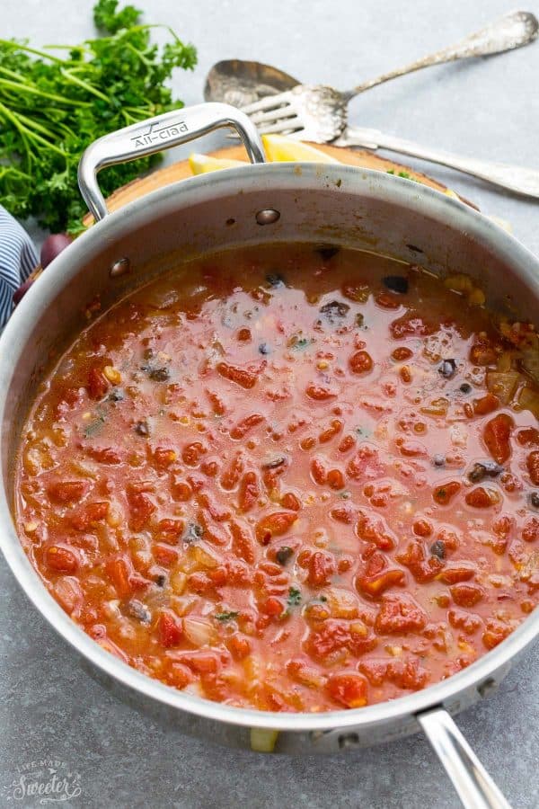 Tomato-based sauce for Steamed Mediterranean PEI Mussels in a skillet