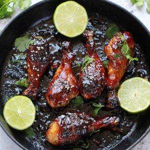 Sticky Honey Sriracha Chicken - Easy chicken drumsticks loaded with zesty Asian flavors are the perfect balance of spicy, tangy & sweet.
