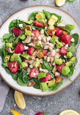 Strawberry Spinach Salad with Avocado, Chicken & Lemon Dressing - perfect healthy low carb / keto lunch made with fresh greens, avocado, nuts & cheese.