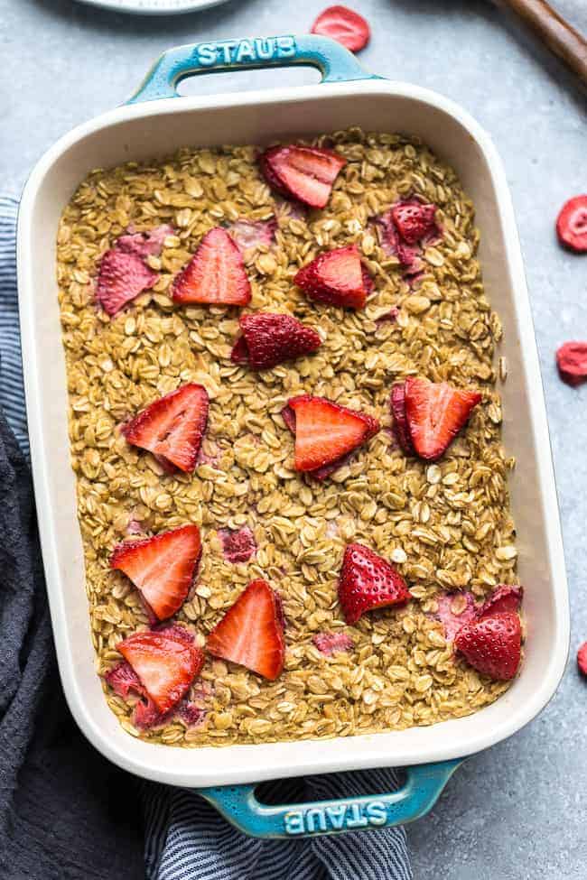 Strawberry Baked Oatmeal (Muffin Cups) - the perfect easy make ahead breakfast for spring and summer. Best of all, this recipe is simple to customize and made with gluten free oats, sweet and juicy fresh & freeze-dried strawberries and refined sugar free.