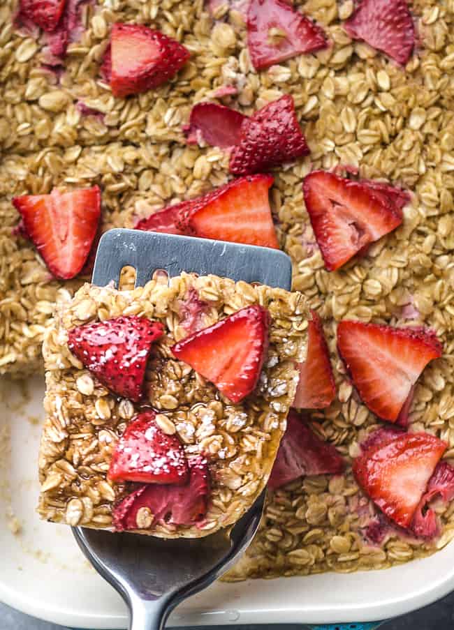 Strawberry Baked Oatmeal (Muffin Cups) - the perfect easy make ahead breakfast for spring and summer. Best of all, this recipe is simple to customize and made with gluten free oats, sweet and juicy fresh & freeze-dried strawberries and refined sugar free.