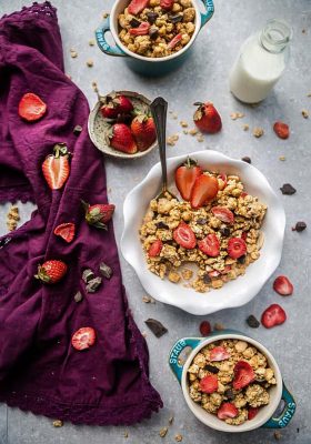 Strawberry Double Chocolate Granola makes the perfect gluten free breakfast or after school / pre or post workout snack. Loaded with crunchy clusters, shredded coconut, white and dark chocolate chips along with freeze-dried and fresh strawberries. Best of all, this recipe is gluten free and refined sugar free and works great for Sunday meal prep.