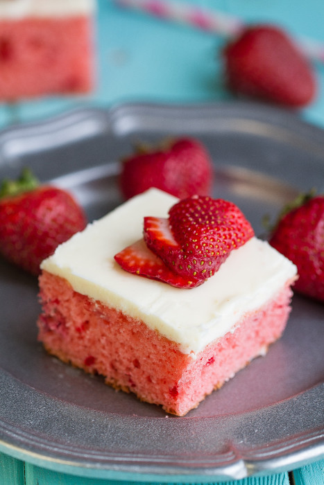 Strawberry Frosted Sheet Cake is bursting with loads of fresh strawberries and perfect for sharing at summer parties