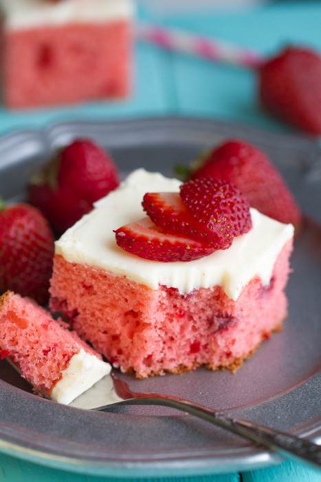 Strawberry Frosted Sheet Cake is bursting with loads of fresh strawberries and perfect for sharing at summer parties