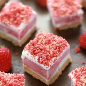 Layered Strawberry Shortcake Ice Cream bars cut into squares
