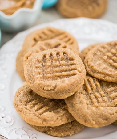 6 Soft and Chewy Keto Peanut Butter Cookies on a white plate