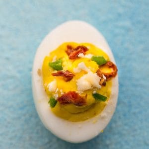 Perfect Deviled Eggs - 12 different ways are the perfect easy make-ahead appetizers for Easter Mother's Day or any weekend or holiday brunch. Best of all, they are low carb, keto and packed with protein. Flavors include: smoked salmon, broccoli & cheese, buffalo chicken, spicy chili, chipotle & salsa, avocado, bacon & cheese, classic deviled egg, sun-dried tomato, southwestern, ham & cheddar & dill pickle