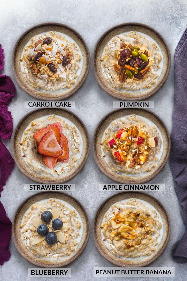 Top view of six steel cut oats bowls with different toppings on a grey background and napkins