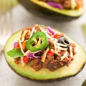 Taco Stuffed Avocado Cups – a fun appetizer based on the classic Mexican favorite and perfect for parties. Best of all, this recipe is gluten free, keto and low-carb friendly.