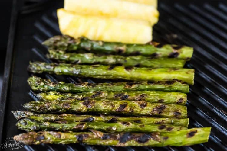 Asparagus and pineapple spears on a grill