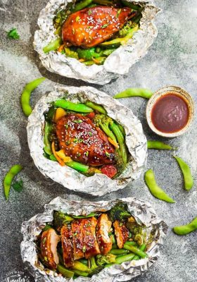 This recipe for Teriyaki Chicken Foil Packets with Vegetables is the perfect easy campfire or weekly dinner for summer. A complete meal with practically no clean up and full of your favorite sweet and savory Asian-inspired meal with tender chicken, edamame, broccoli, pineapple and red bell pepper. Make a batch for Sunday meal prep and pack it up for your lunchbox or lunch bowls. Foil packets are great for camping or busy weeknights.