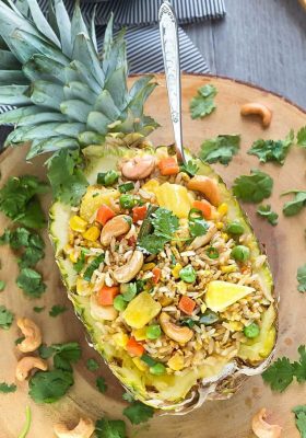 This Pineapple Fried Rice recipe is the perfect easy weeknight side dish to your meal. Best of all, it's easy to customize with any protein like chicken or shrimp and you can add your favorite Thai flavors.. Greta way to clean out your fridge with all those extra vegetables and leftovers also make a great meal to pack for work or school lunch bowls.