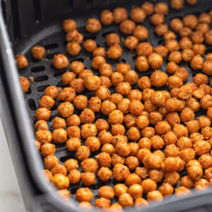 A batch of air fried chickpeas in an air fryer basket
