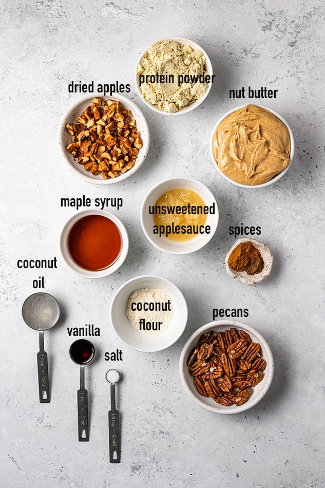 Overhead view of ingredients for apple pie protein bars in individual bowls