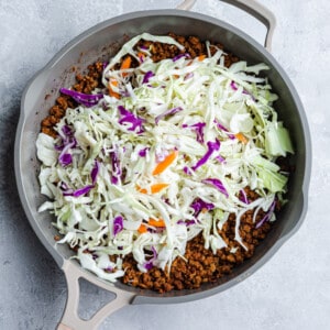 Cabbage slaw with ground meat in a grey pan