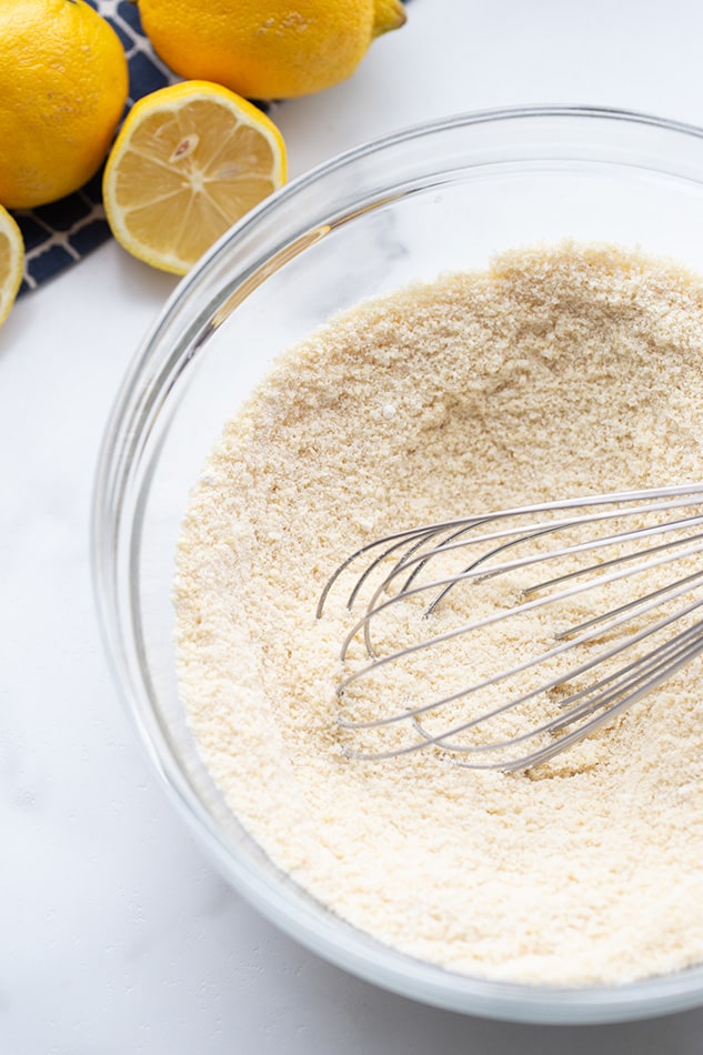 A bowl of dry ingredients for the gluten free lemon cake batter