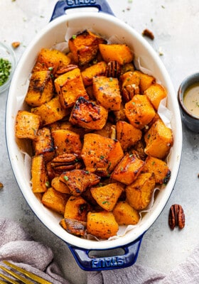 Top view of roasted butternut squash in an oval casserole dish