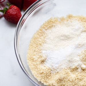 A clear mixing bowl of the dry ingredients to make strawberry shortcake