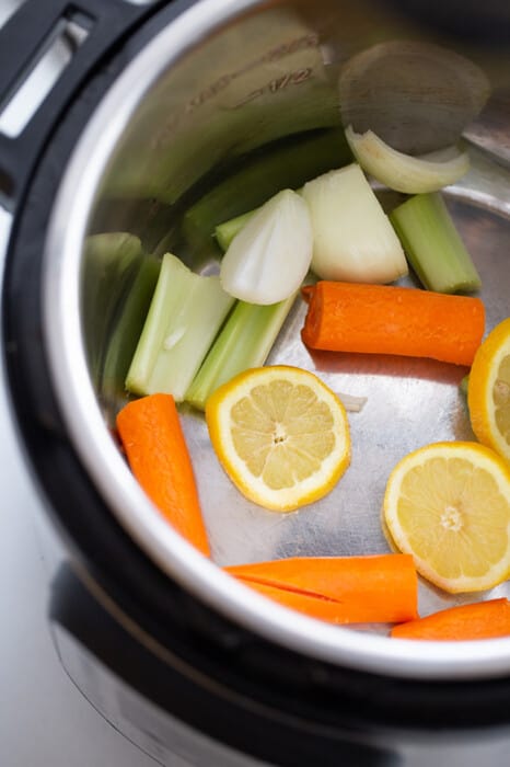 Top view of chopped carrots and celery in an Instant Pot