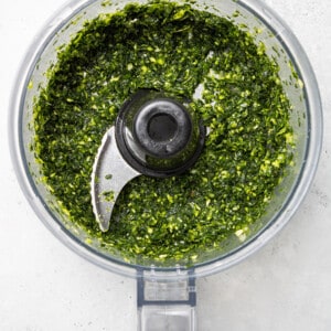 Top view of blended homemade chimichurri sauce in a food processor bowl