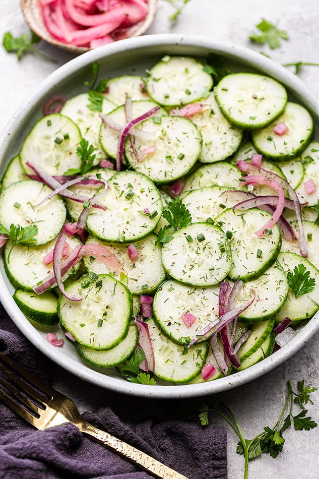 Close-up of Cucumber Salad with red onions in a bowl