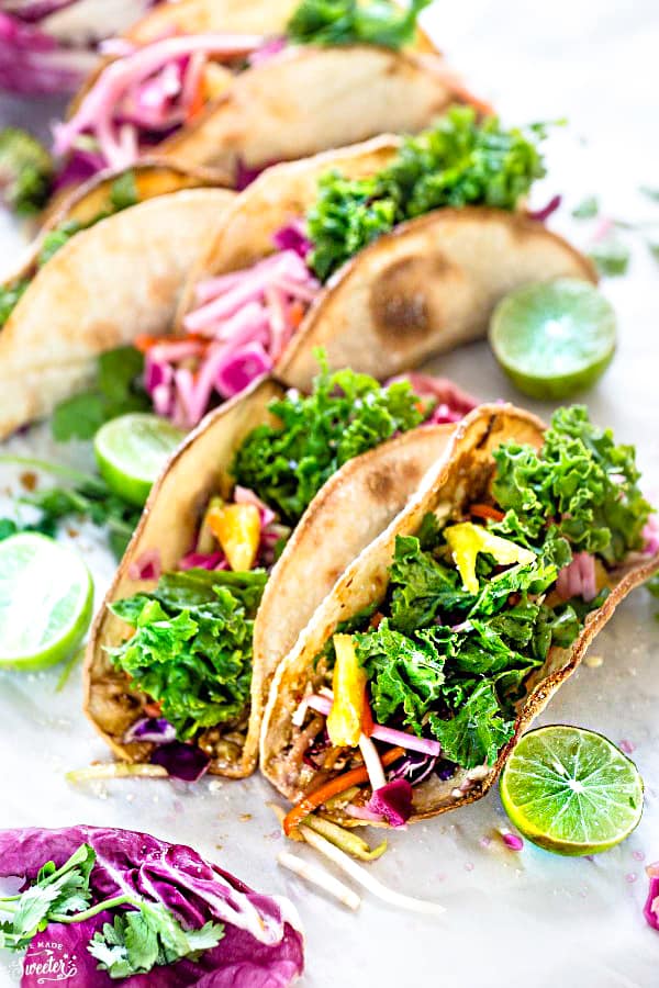 These Asian Tilapia and Kale Slaw Tacos make the perfect light and healthy weeknight meal. Best of all, easy to customize with toasted tortillas topped with flaky white fish fillets (you can use cod, tilapio or sole), a delicious kale slaw with purple cabbage, carrots, daikon and sweet pineapples. Delicious for Taco Tuesday or Cinco de Mayo!