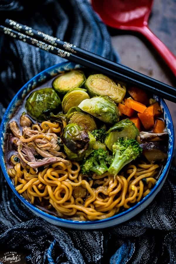 A bowl of Turkey Ramen Noodle soup with brussels sprouts, broccoli, and carrots