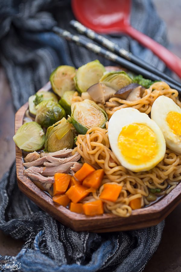 A bowl of Turkey Ramen Noodle soup with brussels sprouts, egg, and carrots