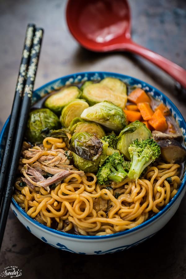 A bowl of Turkey Ramen Noodle soup with brussels sprouts, broccoli, and carrots