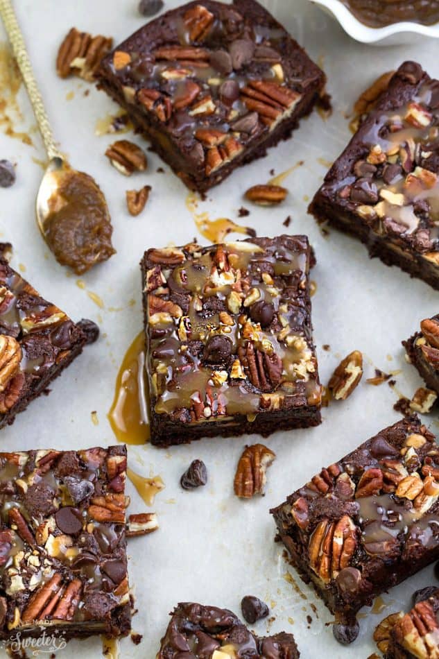 Top view of Paleo Turtle Brownie squares drizzled with caramel sauce