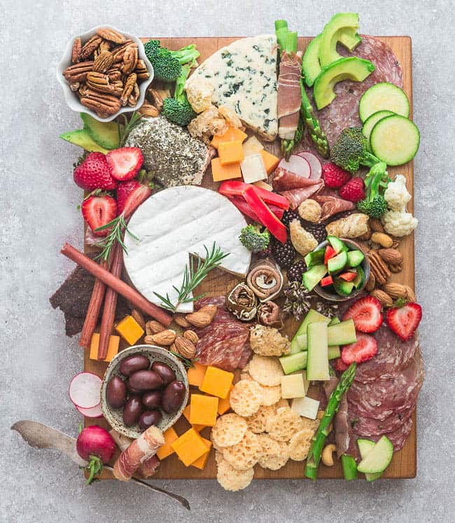 How to Make the Ultimate Charcuterie and Cheese Boards - 6 ways – perfect easy party appetizer tray to make in less than 20 minutes. Everything you need to know to easily build the best charcuterie board plus awesome tips & tricks including 2 low carb / keto boards. Customize using simple pantry ingredients. Recipes include: cured meats, smoked salmon, grilled shrimp, breadsticks, crackers, blue cheese, cheddar, brie, goat cheese, dried fruit, olives, almonds, pecans