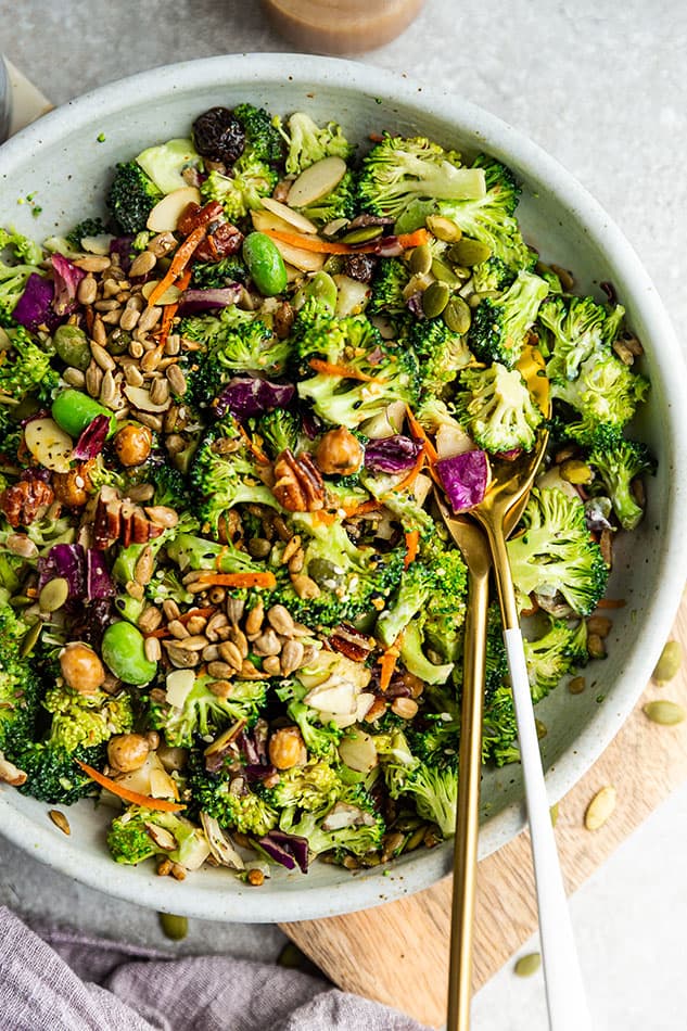 Top view of vegan broccoli salad in a white bowl