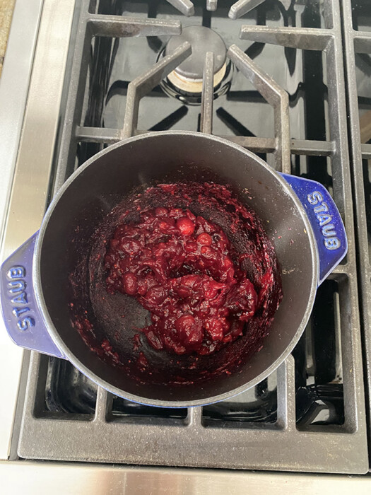 Top view of vegan cranberry sauce in a blue pot