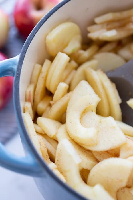 Close-up view of sliced apples in a blue pot