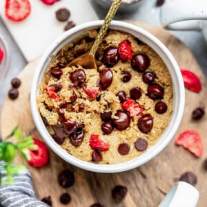 Top view of a spoonful of keto vanilla mug cake in a white bowl