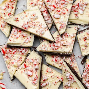 Close-up of a pile of peppermint bark on parchment paper