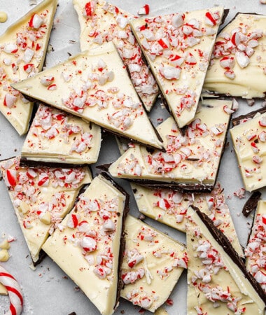 Close-up of a pile of peppermint bark on parchment paper
