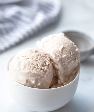 Portrait side photo of vegan vanilla ice cream in a white bowl