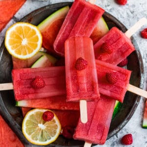 Top view of watermelon popsicles on an antique titanium pie plate