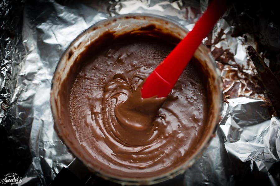 Overhead view of melted chocolate fudge ingredients being mixed