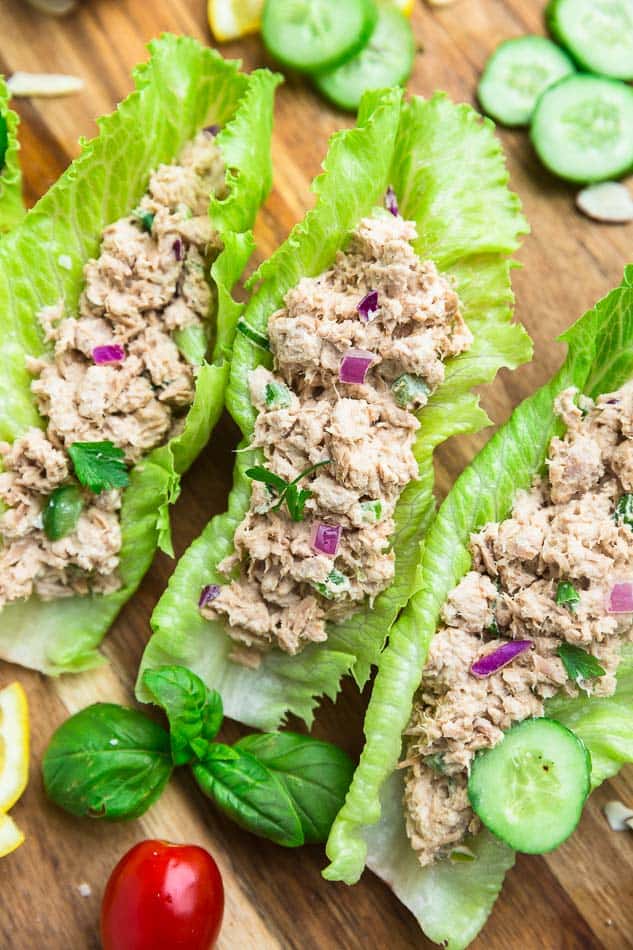 Top view of chicken salad lettuce wraps on a wooden board
