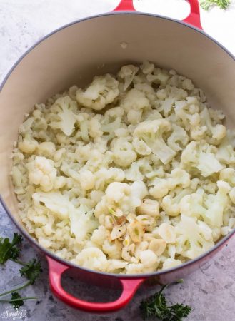 Chopped cauliflower and garlic in a dutch oven pot