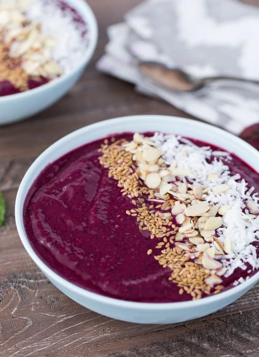 Beet Berry Smoothie bowl with coconut, seeds and nuts on top