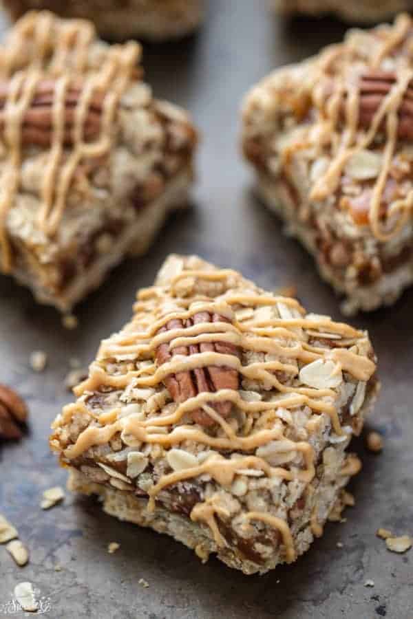 Maple peanut butter oatmeal bars with drizzle and pecan.