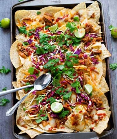 Asian Chicken Nachos - a simple and flavorful appetizer perfect for parties, game day or any meal you want. Best of all, easy to make ahead in the slow cooker or the Instant Pot.