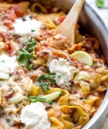 Skillet lasagna with zucchini noodles topped with cheese