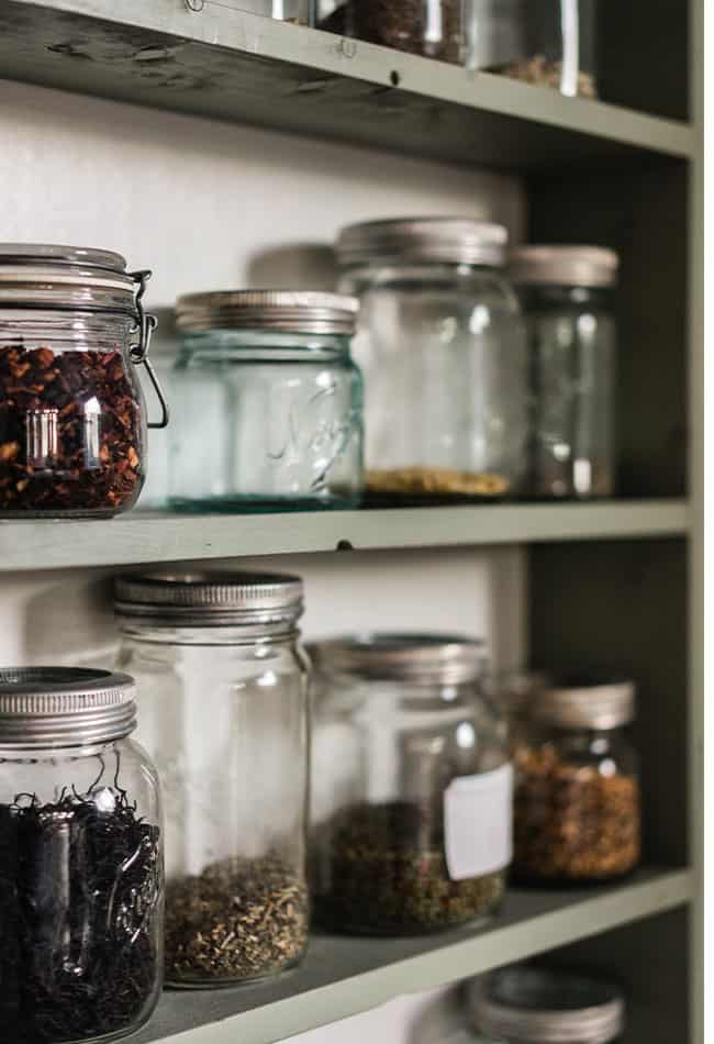 mason jars filled with pantry staples on shelves