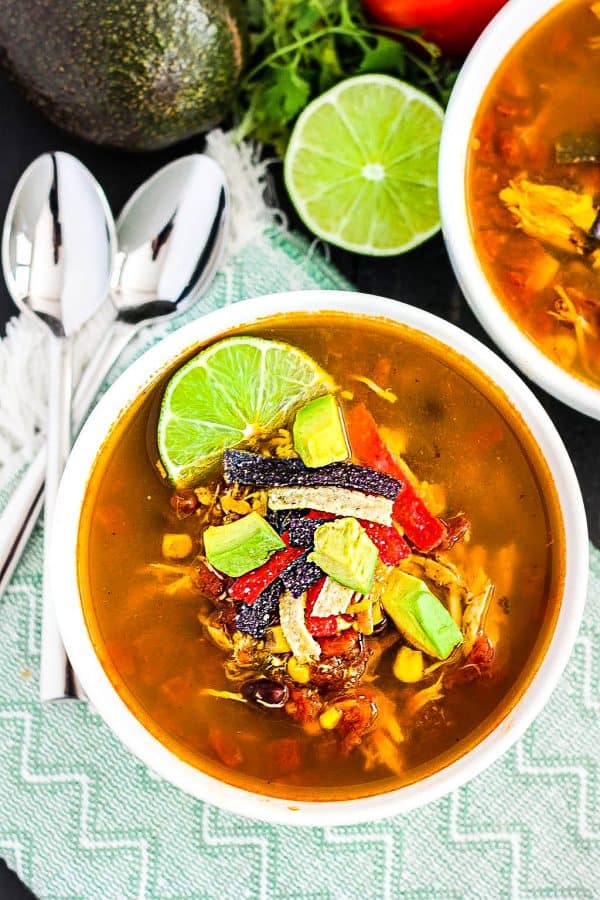 Overhead view of two bowls of Slow Cooker Chicken Tortilla Soup