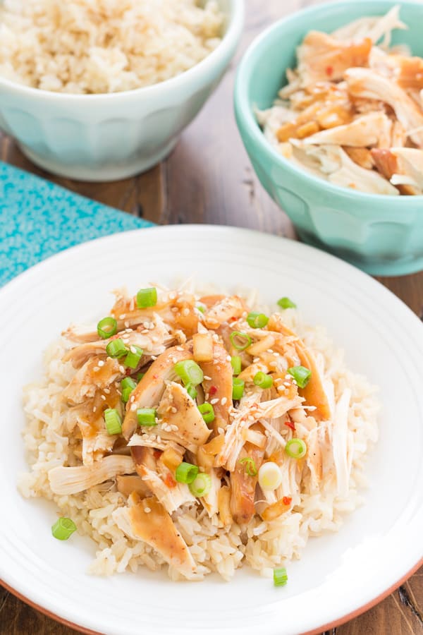 Crock Pot Honey Sesame chicken over rice in a bowl